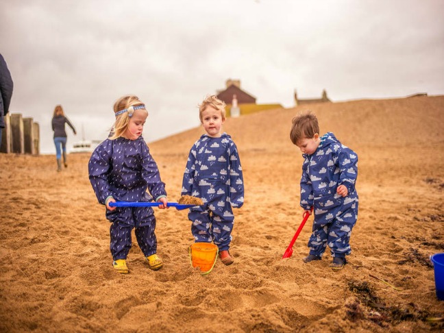 children_beach_puddle-pac-an-all-in-one-navy-raindrops (1)