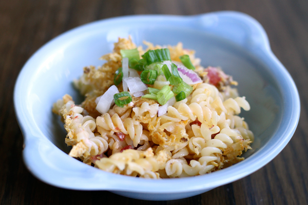 spiral pasta topped with onions