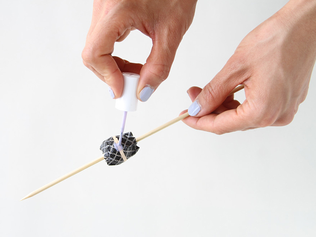 Painting a striped bead.