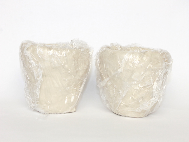 white pots plastic wrap