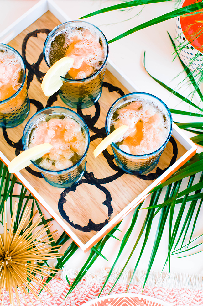 iced tea with lemons on wood tray