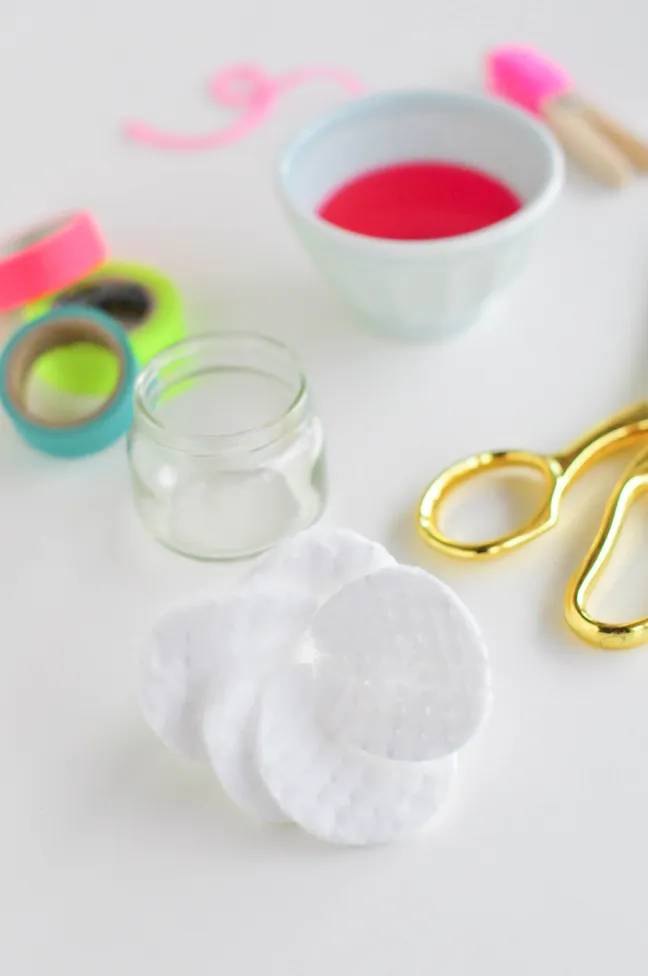 folding round cotton pads in a flower petal shape