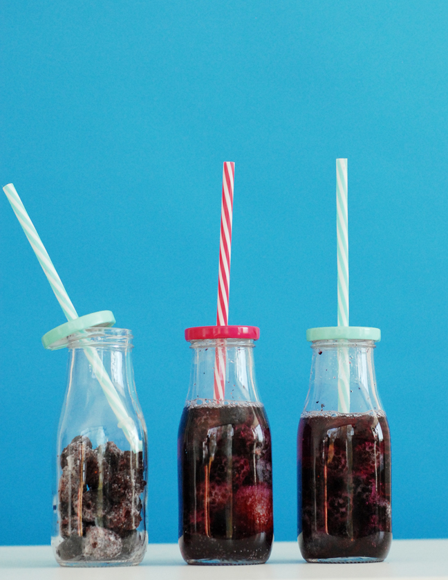 frozen berries in milk bottles