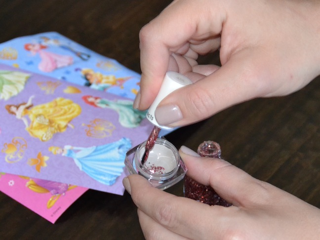 red glitter nail polish on brush