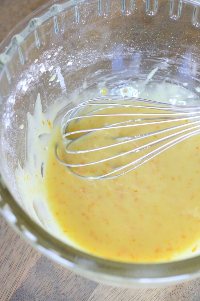 orange powdered sugar glaze whisk