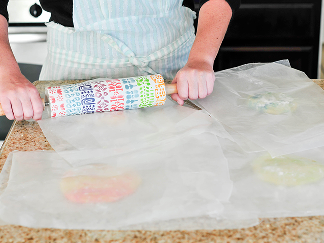 rolling sugar cookie dough wax paper