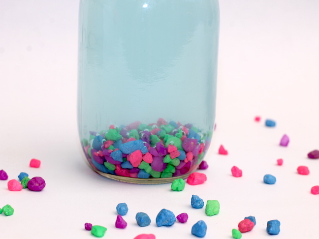 mason jar filled with colorful rocks