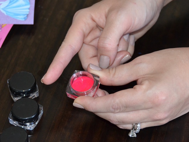 red nail polish in small jar