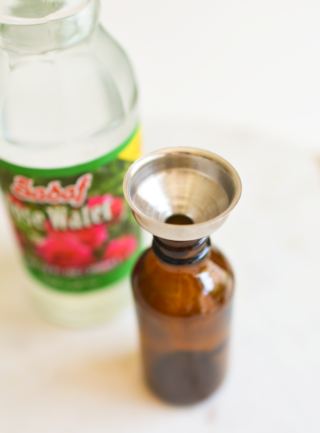 brown glass bottle metal funnel