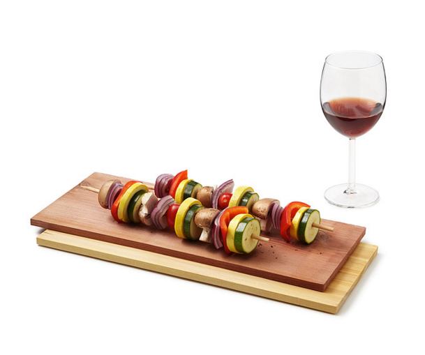 kebabs on wood planks wine glass