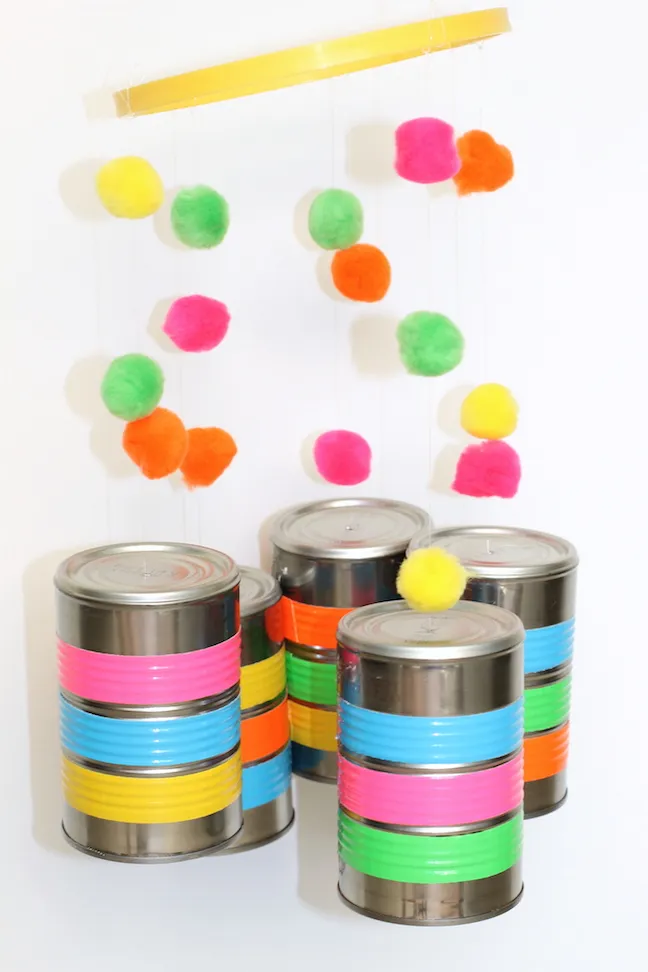 tin cans with duct tape and pom poms