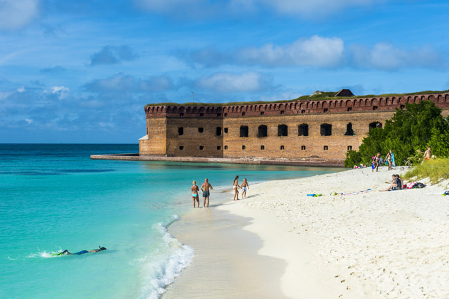 White sand beach and turquoise waters in front of Fort Jefferson, Dry Tortugas National Park, Florida Keys, Florida, United States of America, North America