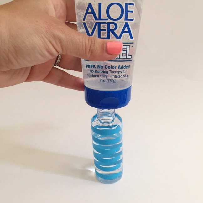 squeezing aloe vera into spray bottle