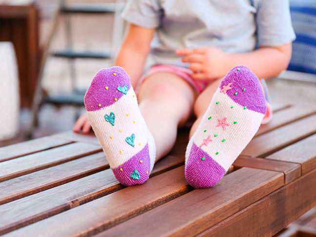 Keep your toddler safe from slips and spills by adding puff paint to the bottoms of their socks \\ \\ Toddler Proofing Tricks You've Never Heard of Before