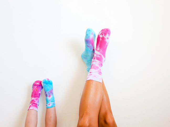 blue and pink tie dyed socks on mom and toddler