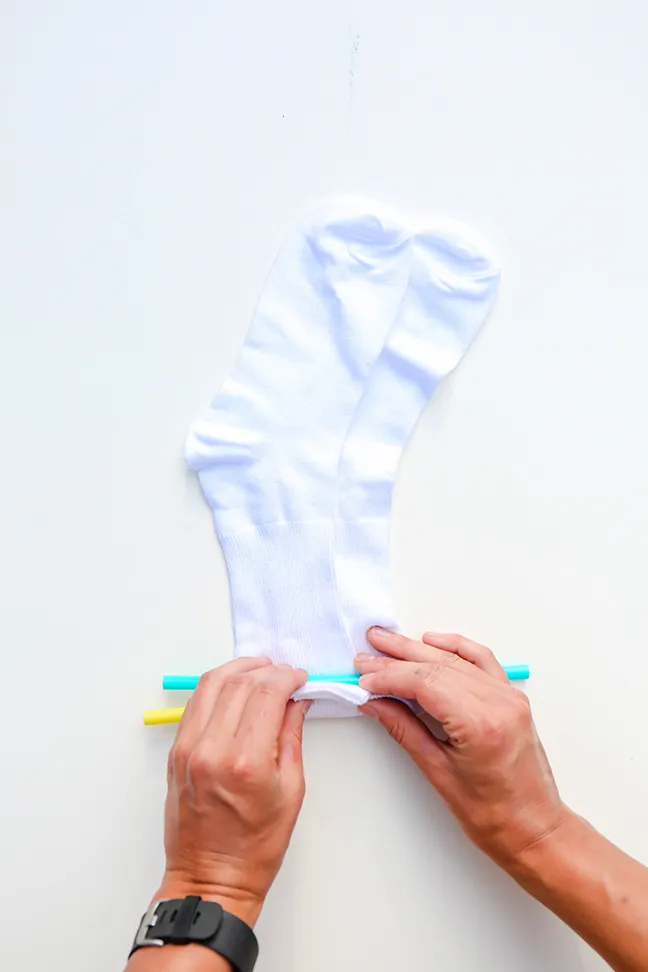 rolling socks with straws