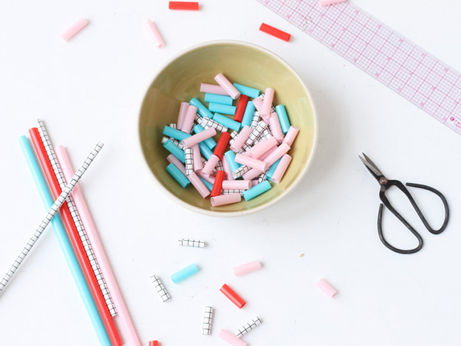 Cut straws to create beads that are all the same length