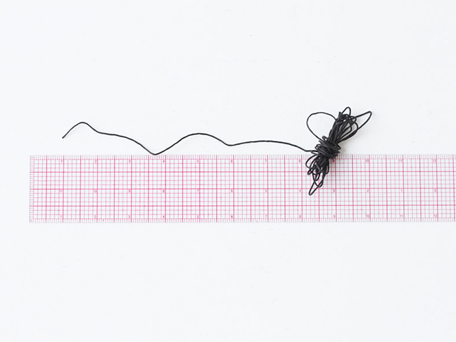 Measure wax sting with ruler