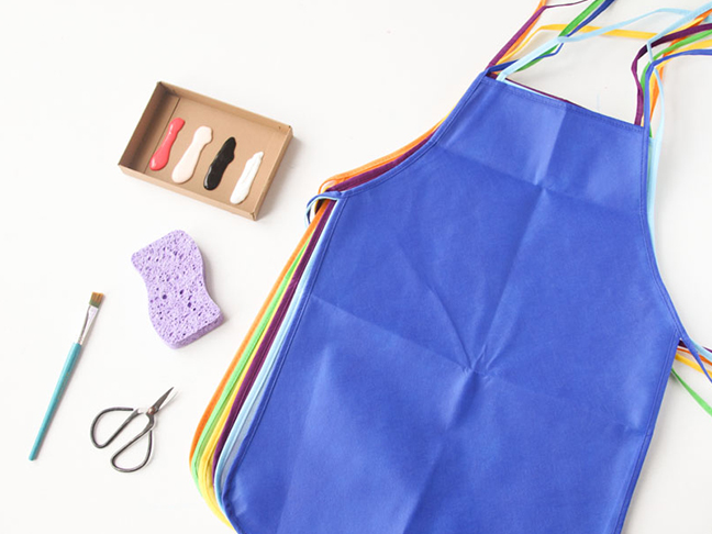Materials needed for DIY artist apron for kids