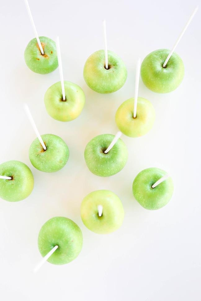 green apples with lollipop sticks