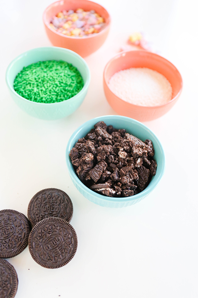 bowl of crushed oreos and green sprinkles