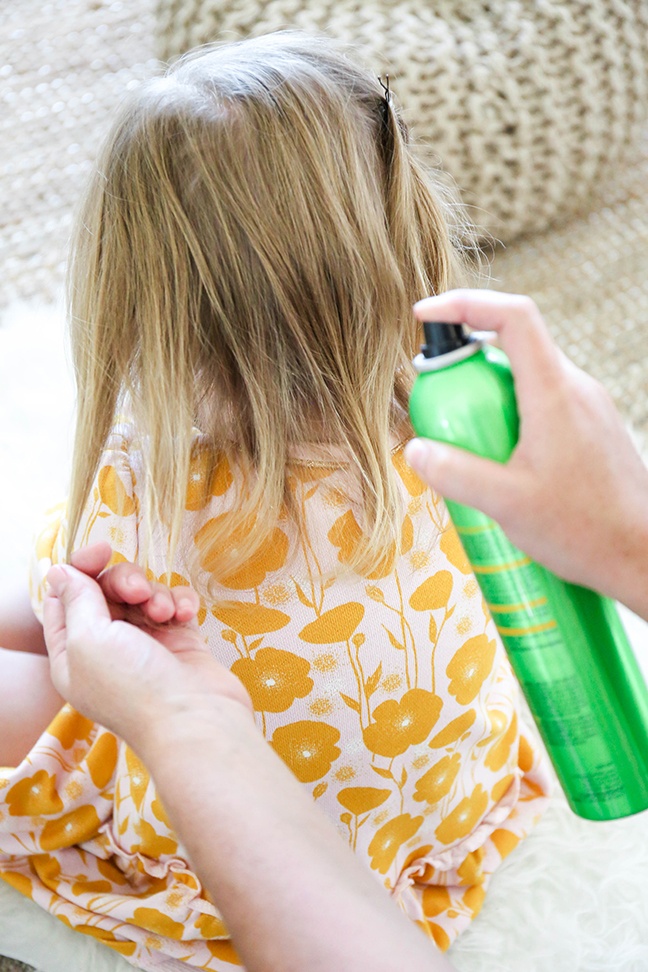 adding hairspray to kid's hair
