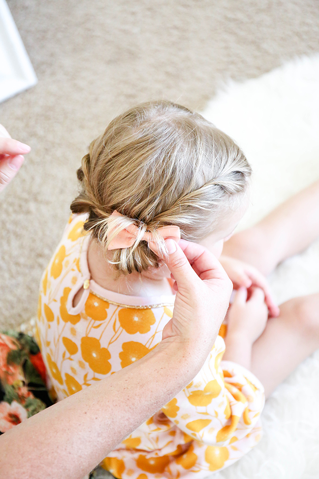 adding bow to toddler braid