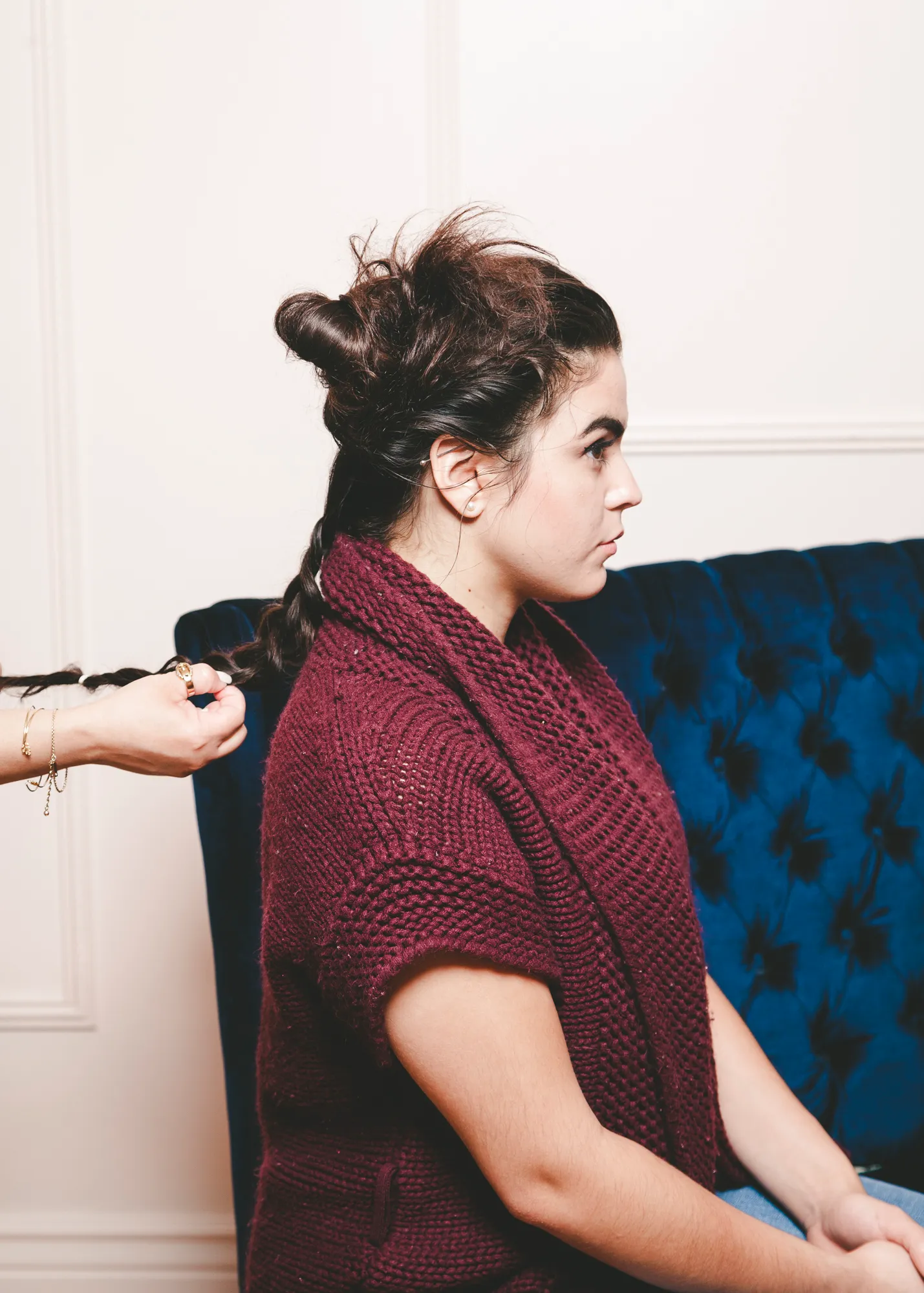 braiding hair to create top knot