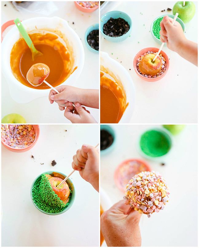 toddler dipping caramel apples into candy