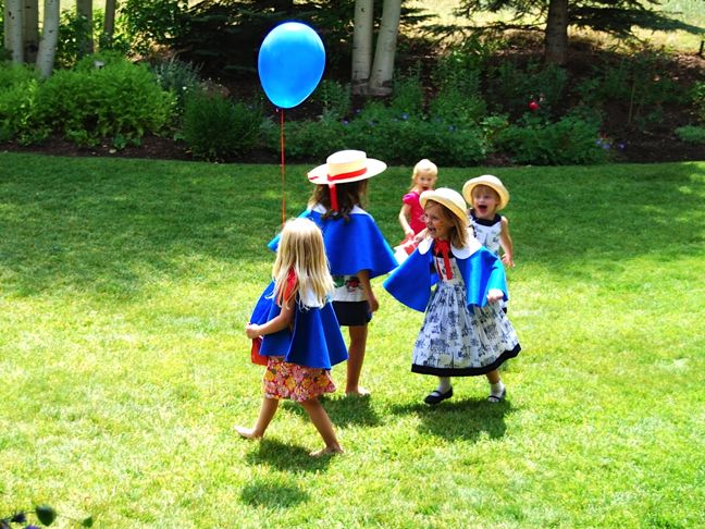 girls-running-blue-cape-balloon-madeline-party