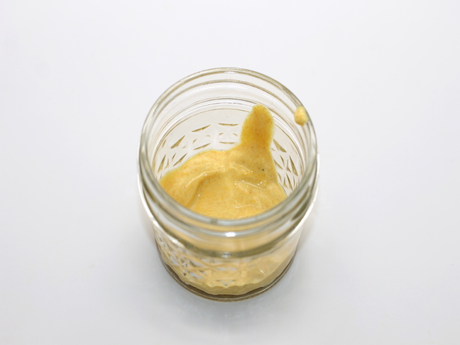 yellow paste in jelly jar