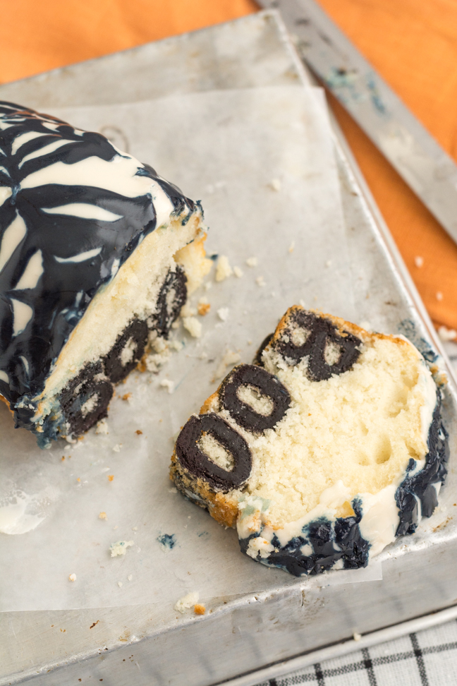 boo cake with slice cut out on wax paper