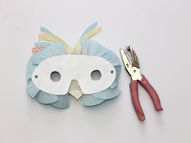 back of owl shaped mask hole punch