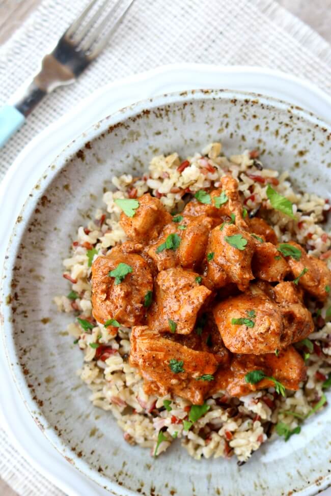 Slow Cooker Butter Chicken--tender, moist bites of chicken in a mildly spiced curry sauce made at home in your slow cooker. Pair it with some rice and naan bread and you'll feel like you're at your favorite Indian restaurant.