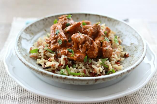 Slow Cooker Butter Chicken--tender, moist bites of chicken in a mildly spiced curry sauce made at home in your slow cooker. Pair it with some rice and Naan bread and you'll feel like you're at your favorite Indian restaurant.