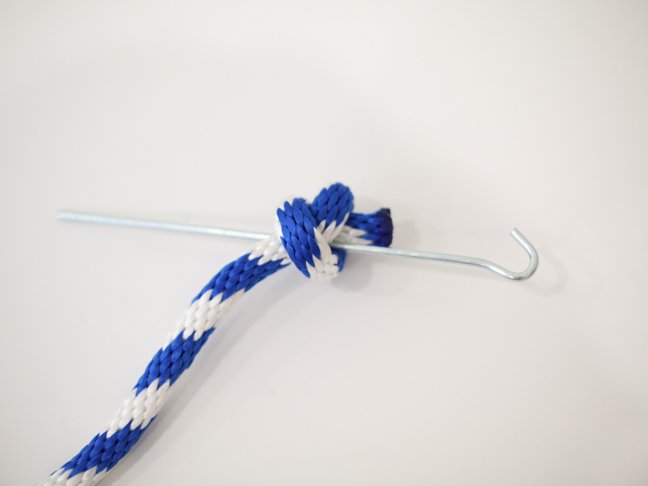 Knotted rope with metal stake