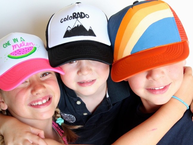 kids-wearing-trucker-hats-with-colorful-diy-art-mountains-watermelon-orange-and-blue-rainbow