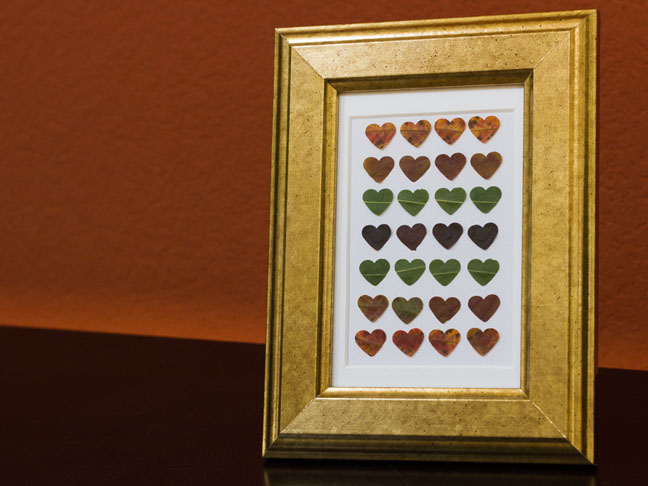 graphic art with hearts in gold frame