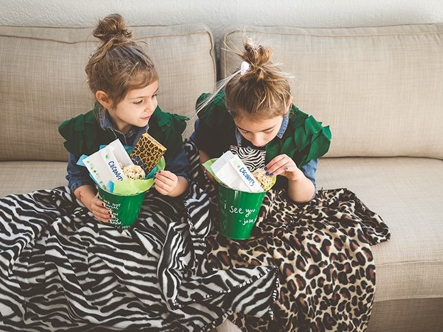 girls-hugging-with-leaf-vests-safari-blankets-jungle-party