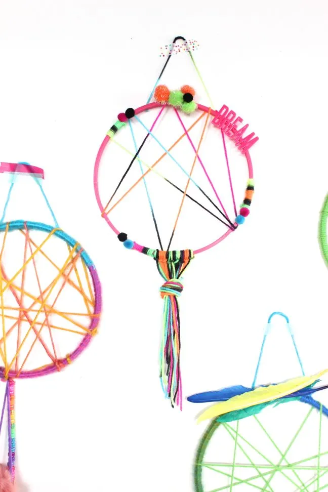 colorful-pink-yellow-blue-green-dream-catcher-for-kids-pom-poms-feathers-sweet-dreams