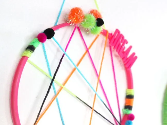 colorful-pink-yellow-blue-green-dream-catcher-for-kids-pom-poms-feathers-sweet-dreams