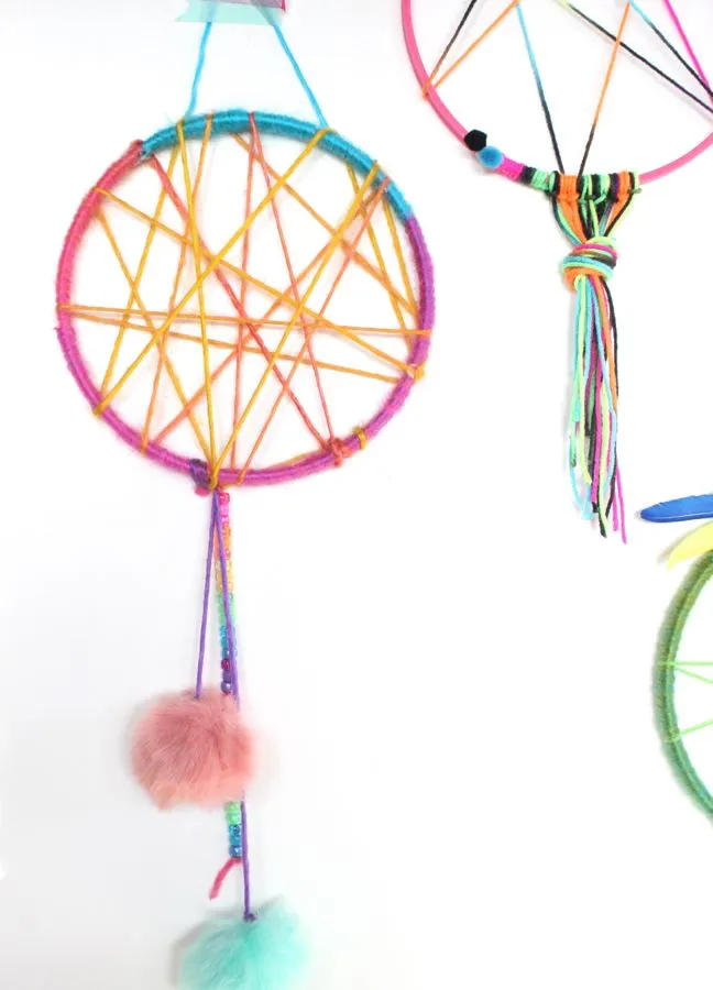 colorful-pink-yellow-blue-green-dream-catcher-for-kids-pom-poms-feathers-sweet-dreams