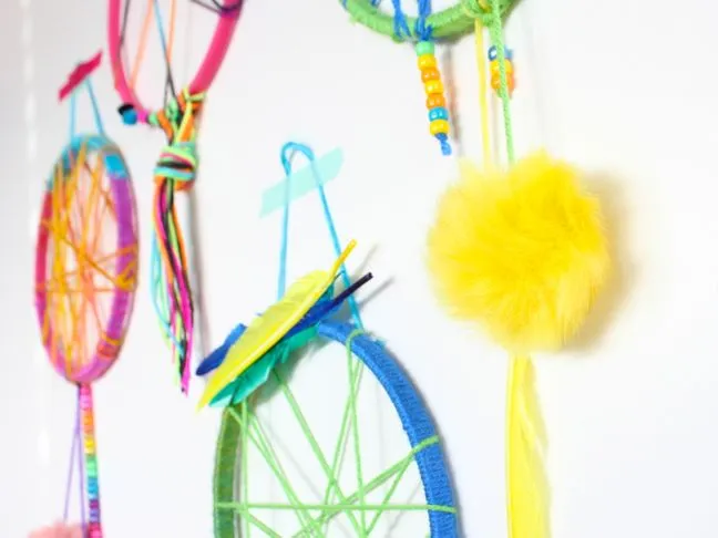 colorful-pink-yellow-blue-green-dream-catcher-for-kids-pom-poms-feathers