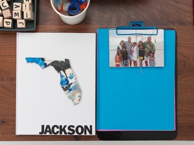 scrapbooking-station-for-kids-marbled-florida-jackson-blue-paper-on-a-clipboard