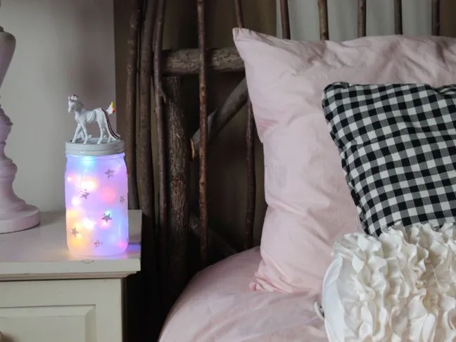 diy-unicorn-night-light-on-a-night-stand-in-a-girls-room-with-pink-bedding