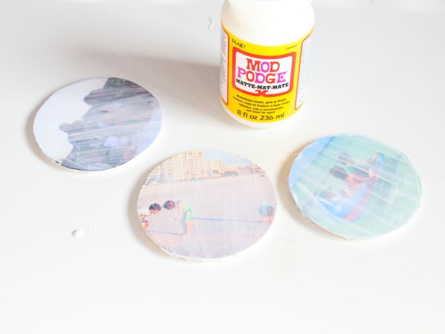 mod-podge-drying-on-round-photos