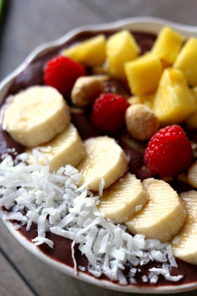 Acai bowls are like a tangy smoothie with toppings in a bowl. Because acai berries are a super food and are full of antioxidants and phytochemicals these smoothie bowls not only taste delicious (like dessert) but they are super nutritious for you too.