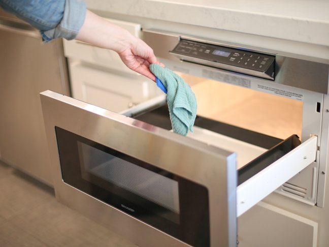 placing-cloth-into-microwave