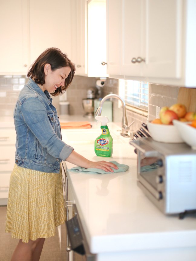 woman-cleaning-kitchen-counter
