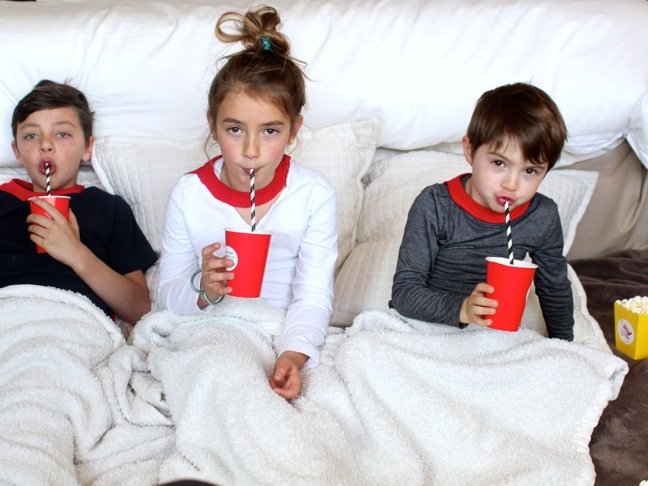 kids-sipping-striped-straws-under-blankets